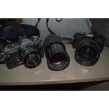 A Minolta XD5 camera, a Minolta XD7 camera, a Rokkor 50mm lens, a Vivitar 70-100mm lens, a Vivitar