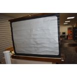 A Houghton Butcher folding projector screen in an oak case