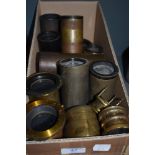 A box of brass projector lenses