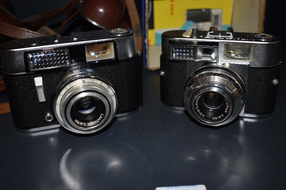 Two Voigtlander cameras, a Vito CL and a Vitomatic Iia both in original leather covers one in