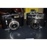 Two Voigtlander cameras, a Vito CL and a Vitomatic Iia both in original leather covers one in