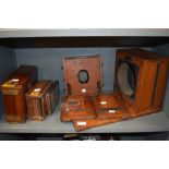 A selection of mahogany camera parts