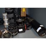 A selection of lenses including Dallmeyer Telephoto, Tamron SP 70-2110mm, Nikkor 55mm, Ohnar zoom