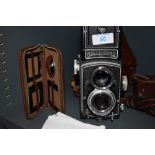 A Rolleicord reflex camera by Franke & Heidecke in original leather cover, with reducer set and