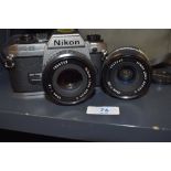 A Nikon FG-20 camera with Nikon series E 50mm and 28mm lens in soft camera bag with filters