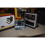 A selection of various Polaroid or Instant cameras, including Kodak EK200, EK300, EK4, Polaroid