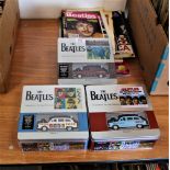 A set of three Beatles boxed limited edition cars - this lot also comes with some Beatles and