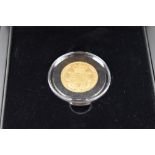 A Gold Sovereign. A 1827 George IV first shield design gold sovereign. In a case. These coins are