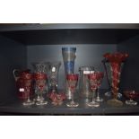 A mixed lot of glass, including etched cranberry glasses,jugs ,vases accented with blue and