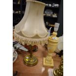 Two table lamps, one in brass the other marble effect.