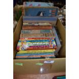 A box of vintage childrens books, including Ladybird and Enid Blyton.