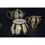 A vintage Sudlows Burslem Made in England teapot, milk jug and sugar basin, having bold gilt stripes