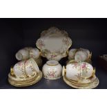 A vintage part tea set having gilt leaf pattern and edging with rose detailing, Plant Tuscan china