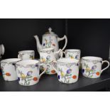 A vintage part coffee set having transfer pattern of poppy seed pods and delicate flowers, with hand