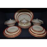 A vintage Mintons part dinner service, having red borders and gilt edging, included are tureens; one