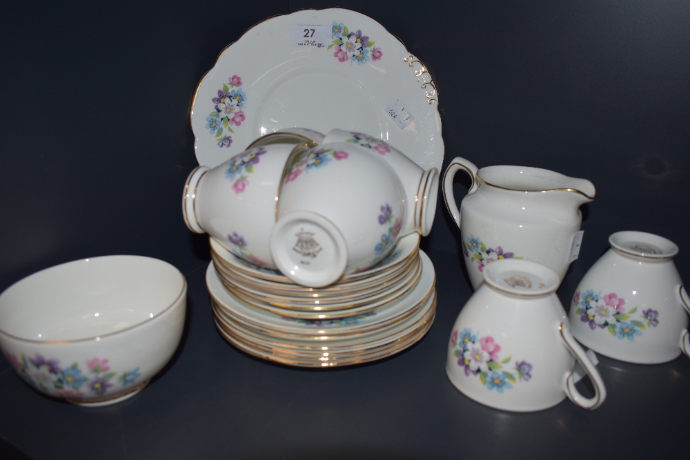 A Taylor and Kent bone china part tea set having pastel floral transfer pattern and gilt edging,