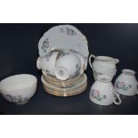 A Taylor and Kent bone china part tea set having pastel floral transfer pattern and gilt edging,