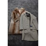A vintage sheepskin ladies coat and an Alexon pure new wool suit in brown and cream, around medium