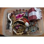 A small selection of costume jewellery including strings of beads, bangles, loose beads etc