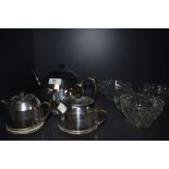 A mid century insulated tea pot, jug and sugar basin, having cream ceramic bodies with chrome