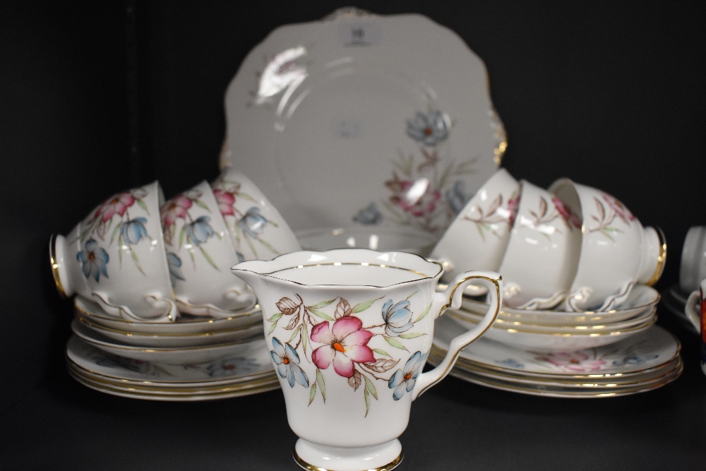 A vintage Royal Staffordshire part tea set having brown transfer pattern with hand coloured floral