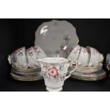 A vintage Royal Staffordshire part tea set having brown transfer pattern with hand coloured floral