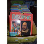 A box full of Discovery magazines.