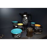 A vintage Crown Devon Harlequin part coffee set in black with white transfer pattern of fruits and