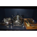 A collection of plated ware and similar and cutlery in butlers caddy, included are tea pot, embossed