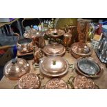 An extensive range of copper ware, including jugs, kettles, pans, hot water bottles, burners and