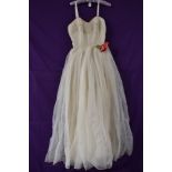 A cream 1950s Jonell evening gown having red velvet to upper bodice(flower to waist appears to be