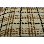 A large piece of vintage wool having brown and black pattern on a cream base. Measures 84' by 60'.