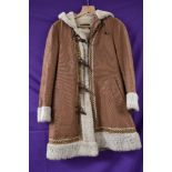 A ladies vintage duffle style coat in brown canvas with faux fur lining and trim to hood, cuffs