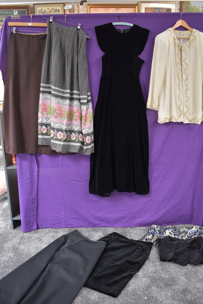 A mixed lot of vintage including three 1960s maxi skirts and a velvet dress,a 1980s velvet Marks and