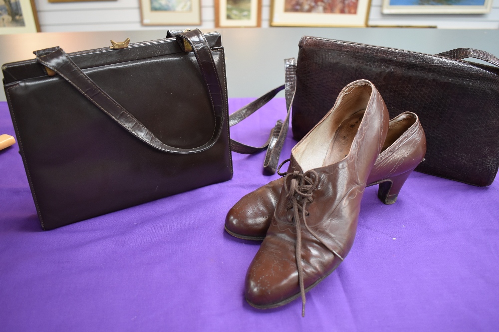 A pair of 1940s women's brown brogue style lace up shoes, around a size 7 and two vintage handbags,