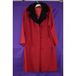 Vintage 1960s red wool coat having Astrakhan collar, two pockets to front and is fully lined, very