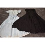 Two vintage dresses, one 1930s in pale blue, structurally sound but has age staining throughout,