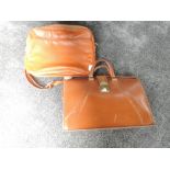 A vintage tan Coloured leather Cheney case with handle, and similar vinyl shoulder bag.