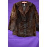 A vintage ladies fur coat, feels to be pony or similar, chestnut brown in colour and fully lined,