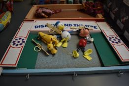 Three 1960's Walt Disney plastic and string figures, Donald Duck, Mickey Mouse and Pluto along