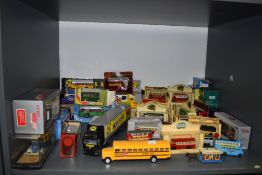 A shelf of mixed diecast buses and similar diecasts including Lledo, Matchbox etc, most boxed