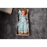 A Unica (belguim) composition doll having sleep eyes, open mouth with two teeth showing and