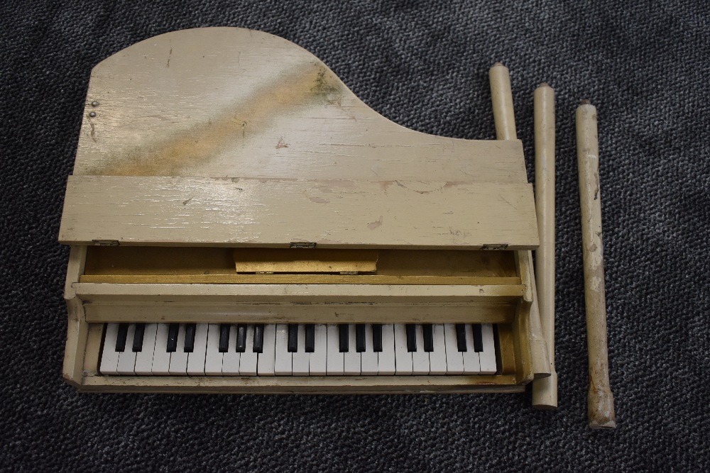 A mid 20th century wooden toy Baby Grand Piano