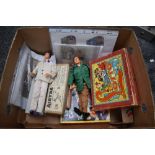 A box of mixed toys and games including 1960's Palitoys Action Man, Rosebud dollin original box,