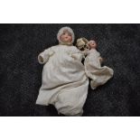 An early 20th century Heubach Koppelsdorf bisque headed doll having sleep eyes, open mouth with