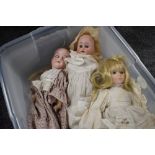 An early 20th century Armand Marseille bisque headed doll having sleep eyes, open mouth with four