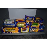 A collection of twenty Corgi (Great Britain) diecast buses and vans, all boxed