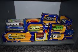A collection of twenty Corgi (Great Britain) diecast buses and vans, all boxed