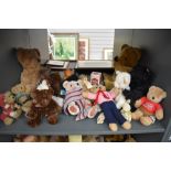 A collection over three shelves of modern Teddy Bears including Steiff, Russ Past times, Mary Meyers