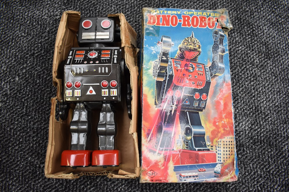 A 1960's SH (Japan) tin plate and battery operated Dino-Robot having open and closed head to